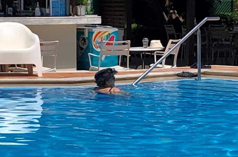 Elderly Greek Woman in Pool